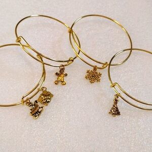 Beautiful faux gold wire charm bracelets with Christmas charms.